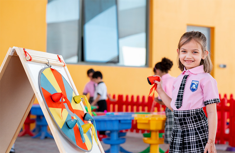 Student engaged in joyful activity-based learning at IISAUH